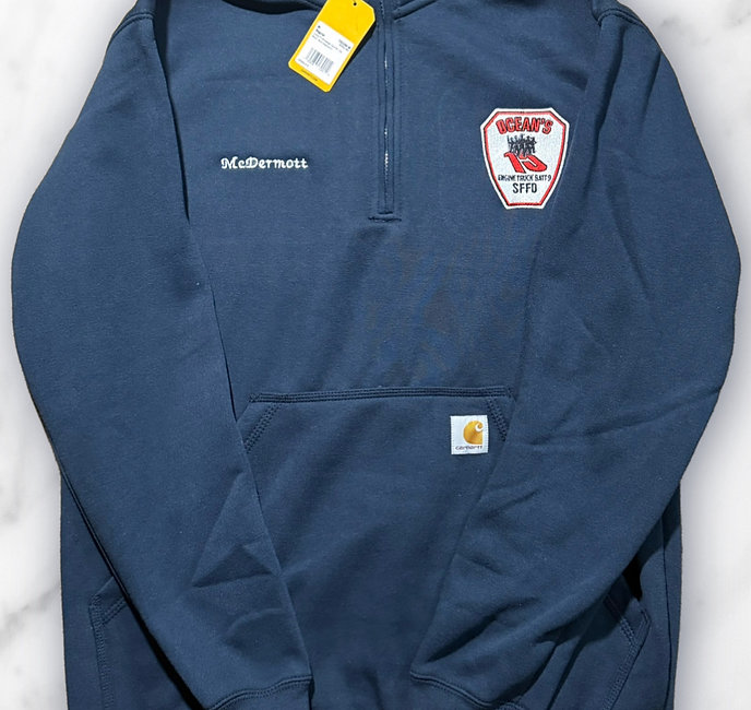 Navy Carhartt quarter-zip embroidered with the name "McDermott" and an SFFD Ocean's Engine, Truck and Battalion 9 shield