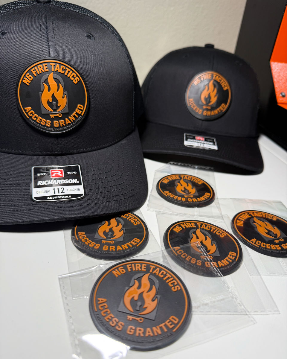 NB Fire Tactics caps beside a run of matching embroidered patches