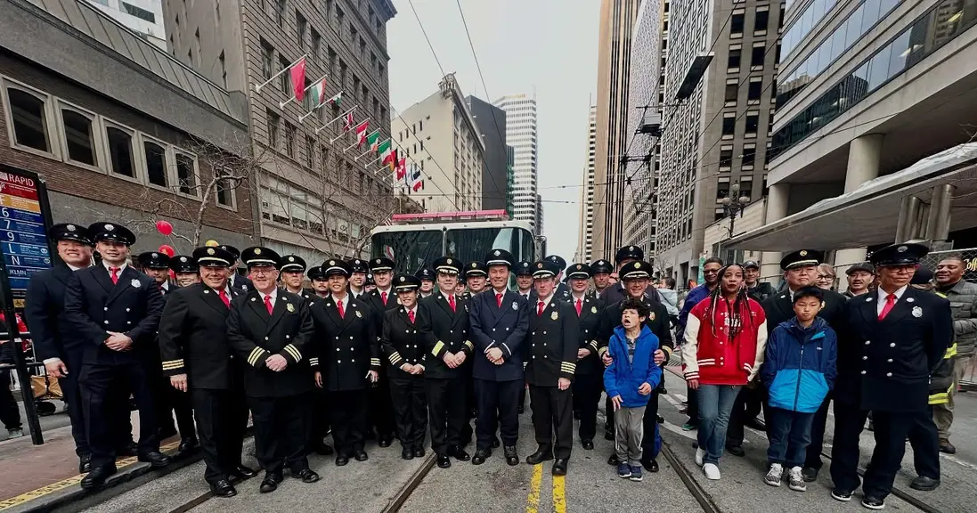 Firefighter in city streets with children